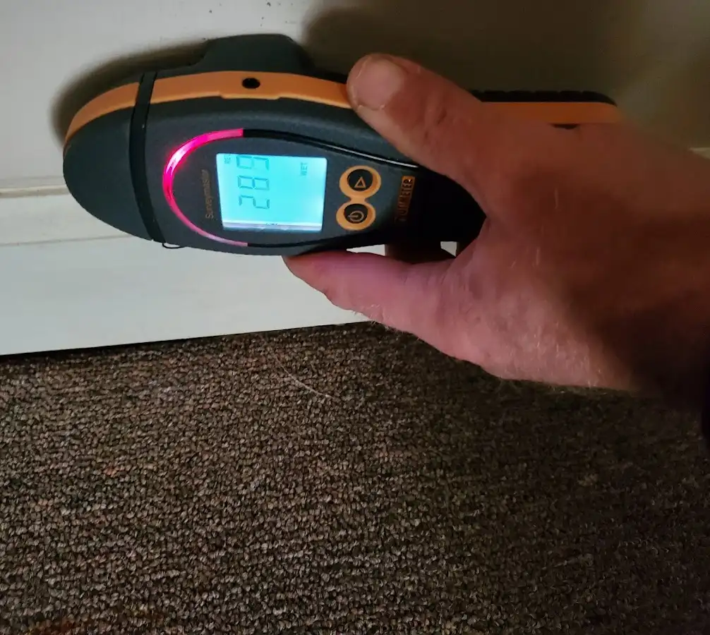 Moisture detection at baseboard during Burst Pipe Cleanup in Narragansett